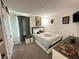 Nicely decorated bedroom with a closet, gray curtains, and decor at 1220 Hilltop Pl # 1220, St Cloud, FL 34772