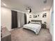 This stylish main bedroom features modern furniture, soft textures, and ceiling fan at 1220 Hilltop Pl # 1220, St Cloud, FL 34772