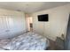 Bedroom features bed, tv and closet at 1220 Hilltop Pl # 1220, St Cloud, FL 34772