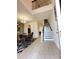 Inviting entryway with soaring ceilings, tile flooring, and staircase leading to the upper level at 1220 Hilltop Pl # 1220, St Cloud, FL 34772