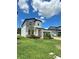 Two-story home with brick driveway, and manicured landscaping at 1220 Hilltop Pl # 1220, St Cloud, FL 34772