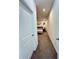 Hallway leading to a bedroom showcasing the home's neutral color palette and design at 1220 Hilltop Pl # 1220, St Cloud, FL 34772