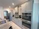 Updated kitchen featuring granite countertops, stainless appliances, and plentiful storage at 1220 Hilltop Pl # 1220, St Cloud, FL 34772