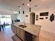 This expansive island kitchen shows an eat-in bar, modern pendants, and stone counters at 1220 Hilltop Pl # 1220, St Cloud, FL 34772