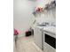 The laundry room features a utility sink, a washing machine and a dryer at 1220 Hilltop Pl # 1220, St Cloud, FL 34772