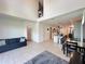 Bright, open-concept living room boasts neutral tile flooring, high ceilings, and modern design elements at 1220 Hilltop Pl # 1220, St Cloud, FL 34772