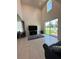 Bright living room with large sliding doors opening to the backyard and comfortable seating at 1220 Hilltop Pl # 1220, St Cloud, FL 34772