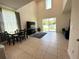 Bright living room with large sliding doors opening to the backyard and comfortable seating at 1220 Hilltop Pl # 1220, St Cloud, FL 34772