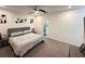 The main bedroom has neutral decor, ceiling fan, and ensuite bath at 1220 Hilltop Pl # 1220, St Cloud, FL 34772