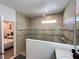 Modern bathroom showcasing a tiled glass shower with a neutral stone color palette at 1220 Hilltop Pl # 1220, St Cloud, FL 34772