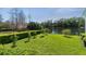 Beautiful backyard view features an iron fence overlooking a tranquil lake with lush greenery at 1251 Aquila Loop, Celebration, FL 34747