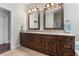 Bathroom with double sink vanity, granite countertops, and tile flooring at 1251 Aquila Loop, Celebration, FL 34747
