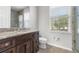 Bathroom featuring wood cabinets with granite counters and a glass enclosed shower at 1251 Aquila Loop, Celebration, FL 34747