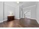 Bedroom featuring hardwood floors, natural light, traditional decor, and entry to additional rooms at 1251 Aquila Loop, Celebration, FL 34747