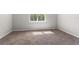 Cozy bedroom with neutral carpet and a large window for natural light at 1251 Aquila Loop, Celebration, FL 34747