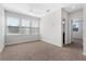 Bonus room has three bright windows, neutral carpeting, and a ceiling fan at 1251 Aquila Loop, Celebration, FL 34747
