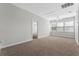 Spacious bonus room features three windows offering lots of natural light and neutral carpeting at 1251 Aquila Loop, Celebration, FL 34747