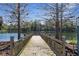 Picturesque wooden dock provides a relaxing spot to enjoy the tranquil lake and scenic surroundings at 1251 Aquila Loop, Celebration, FL 34747