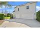 Home exterior featuring a driveway leading to a three-car garage, complemented by a green lawn at 1251 Aquila Loop, Celebration, FL 34747