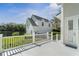 Rear exterior featuring a lake view and an attached garage at 1251 Aquila Loop, Celebration, FL 34747