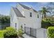 Beautiful exterior view with garage, lake, manicured landscaping, and patio at 1251 Aquila Loop, Celebration, FL 34747