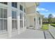 Exterior with bright natural light, complemented by white trim and railings, offers serene and inviting outdoor enjoyment at 1251 Aquila Loop, Celebration, FL 34747
