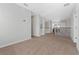 Hallway features neutral carpeting, white railings, and wood accents at 1251 Aquila Loop, Celebration, FL 34747