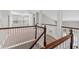 Upstairs hallway and landing overlooking downstairs at 1251 Aquila Loop, Celebration, FL 34747