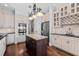 Modern kitchen featuring stainless steel appliances, an island, and white cabinetry at 1251 Aquila Loop, Celebration, FL 34747