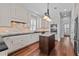 Modern kitchen featuring an island, white cabinets, and stainless steel appliances at 1251 Aquila Loop, Celebration, FL 34747