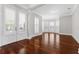Elegant living room with hardwood floors, natural light, and decorative shutters on bay windows at 1251 Aquila Loop, Celebration, FL 34747