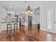 Open-concept living space featuring hardwood floors, kitchen, and a view of the upper level at 1251 Aquila Loop, Celebration, FL 34747