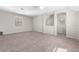 Spacious carpeted loft with neutral paint, two windows, and open space at 1251 Aquila Loop, Celebration, FL 34747