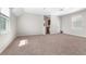 Spacious carpeted loft with neutral paint, two windows, and open space at 1251 Aquila Loop, Celebration, FL 34747
