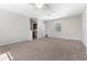 Spacious carpeted loft with neutral paint, one window, and ceiling fan at 1251 Aquila Loop, Celebration, FL 34747