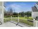 Relaxing patio with lush greenery overlooking lake at 1251 Aquila Loop, Celebration, FL 34747