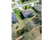 An aerial view of the backyard with well-maintained lawn and view of the neighborhood at 1336 Lattimore Dr, Clermont, FL 34711