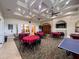 Clubhouse features an open floor plan, tables, and recreational games at 1336 Lattimore Dr, Clermont, FL 34711
