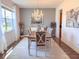 Bright dining room with a chandelier, dining table set, and elegant decor at 1336 Lattimore Dr, Clermont, FL 34711