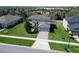 An exterior elevation displays the home's architecture and well-manicured front lawn at 1336 Lattimore Dr, Clermont, FL 34711