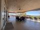 View of a clubhouse patio with comfortable outdoor seating, ceiling fans, and scenic views at 1336 Lattimore Dr, Clermont, FL 34711