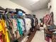 Well-organized walk-in closet with rods, shelves, and ample storage for clothes and accessories at 1336 Lattimore Dr, Clermont, FL 34711