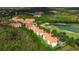 Aerial view showcasing the property's prime location near a golf course and serene lake at 1370 Tuscana Ln # 5406, Davenport, FL 33896
