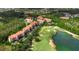 Panoramic aerial view of the property showcasing landscaping, golf course, and nearby lake at 1370 Tuscana Ln # 5406, Davenport, FL 33896