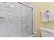 Elegant bathroom featuring a glass-enclosed shower with white marble and modern fixtures at 1370 Tuscana Ln # 5406, Davenport, FL 33896