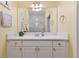 Stylish bathroom with a modern vanity, a large mirror, and elegant fixtures at 1370 Tuscana Ln # 5406, Davenport, FL 33896