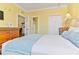 Comfortable bedroom featuring a plush bed, complemented by ensuite bath and living area at 1370 Tuscana Ln # 5406, Davenport, FL 33896
