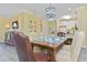 Comfortable dining area with seating for six people and views of the open-concept kitchen at 1370 Tuscana Ln # 5406, Davenport, FL 33896