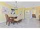 Inviting dining area with stylish chandelier, seating for four, and decorative wall art at 1370 Tuscana Ln # 5406, Davenport, FL 33896