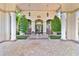 Beautiful entrance with manicured landscaping, benches, and classic architectural details and lighting at 1370 Tuscana Ln # 5406, Davenport, FL 33896